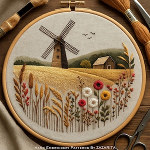 May include: Hand-embroidered landscape scene in a wooden hoop. The design features a windmill, wheat field, and wildflowers in shades of brown, yellow, red, and white. The text "HAND EMBROIDERY PATTERNS BY ZAZARITA" is at the bottom.