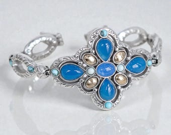 Pulsera Brighton Nadia Retired Cross con piedra de cristal azul turquesa bañada en plata