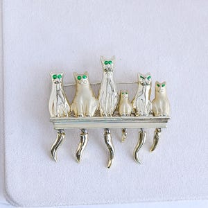 Vintage Gold Cat Brooch: Dangling Tails, Green Eyes
