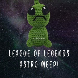 May include: A green crocheted alien with black eyes and a sad expression. The alien is sitting on a dark blue background with white stars. The text "League of Legends Astro Meep! PDF Crochet Pattern" is written in white below the alien.