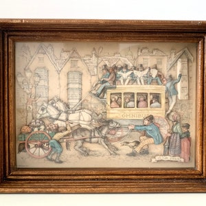 May include: A framed paper art print depicting a horse-drawn carriage and a yellow omnibus in a busy city street. The print is titled "Anton Pieck" and features a detailed illustration of the scene.