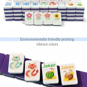 May include: A set of colorful Mahjong tiles with various designs, including flowers, dragons, and the word "Joker." The tiles are white with vibrant illustrations and text, and the set includes purple and white components. The text "Environmentally friendly printing vibrant colors" is also visible.