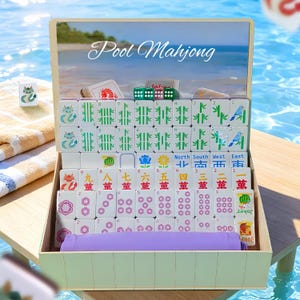May include: A wooden box set of Pool Mahjong tiles, featuring a beach scene on the lid. The tiles are white with various symbols and numbers. Includes dice and a purple tile holder. The text "Pool Mahjong" is visible.