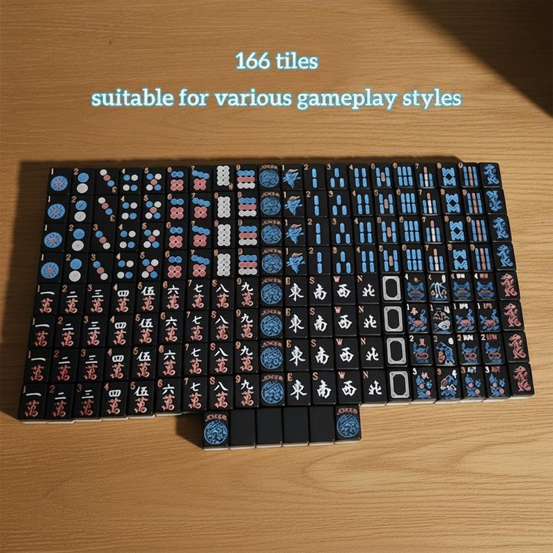 May include: A set of 166 black Mahjong tiles, suitable for various gameplay styles. The tiles feature Chinese characters and symbols in white, red, and blue. The tiles are arranged on a wooden surface.