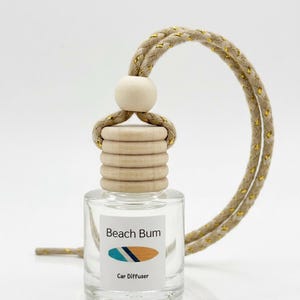 May include: A set of three ceramic mugs with a speckled, matte finish. The mugs are in shades of cream, light gray, and dark gray. Each mug has a simple, minimalist design and a rounded handle.