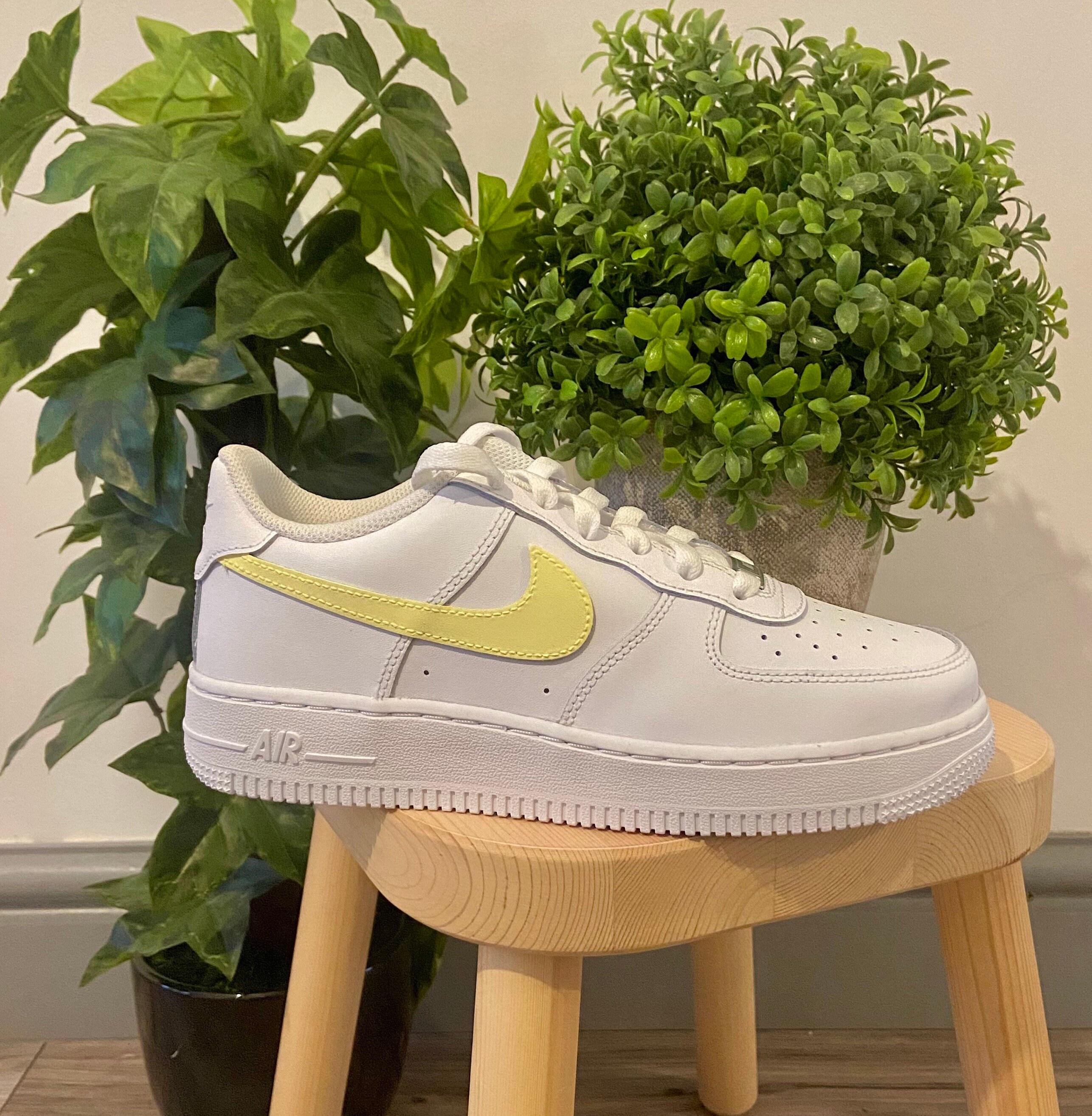 white air force 1 with yellow tick