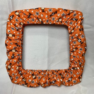 Orange Halloween Candy fabric grime guard.