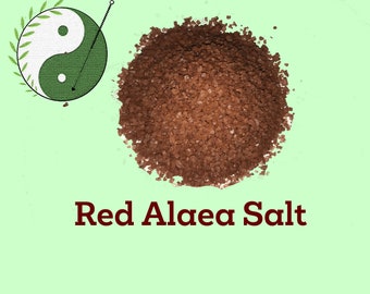 May include: Red Alaea salt, a coarse, reddish-brown salt, in a pile on a light green background. The text "East West Herbal" is at the top of the image, and the text "Red Alaea Salt" is at the bottom of the image.