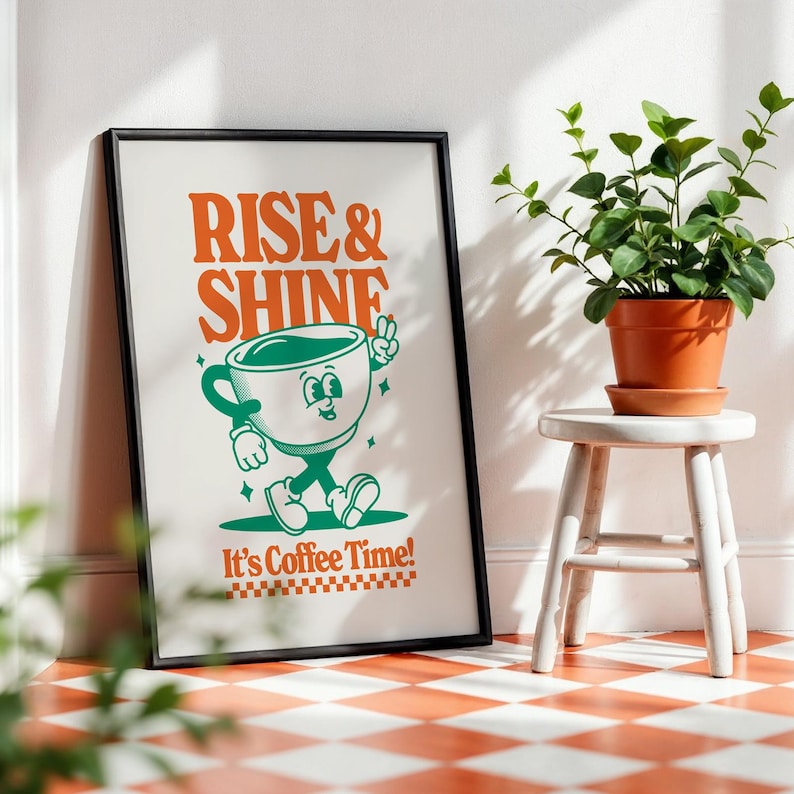 May include: A black framed poster with the text "Rise & Shine" in orange and green. A cartoon coffee cup with a face and legs walks across the poster. The text "It's Coffee Time!" is below the cup.