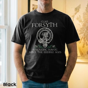 May include: Black crew neck t-shirt with the text "Clan Forsyth" and a circular emblem featuring a griffin and the words "Instaurator Ruinae". The shirt also has the phrase "Wreaking Havoc Since The Middle Ages".