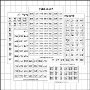 May include: A collection of white planner stickers with black text. The stickers include weekly calendars, monthly calendars, and individual date stickers. The brand name "yin&paper" is printed on the stickers. The website "yinandpaper.etsy.com" is also printed on the stickers.