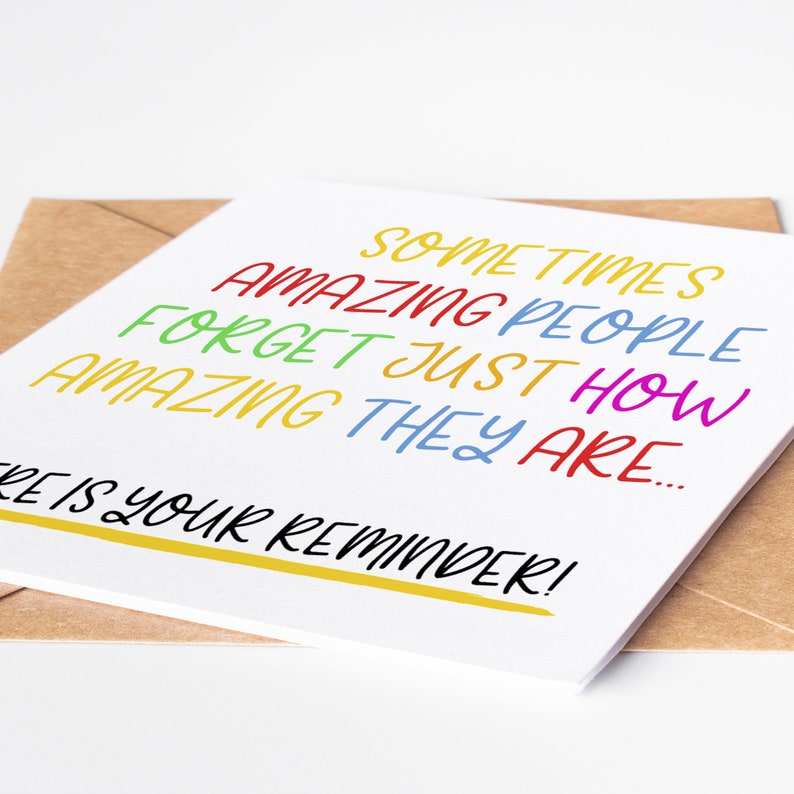 May include: A white card with the text "Sometimes amazing people forget just how amazing they are... This is your reminder!" in colorful lettering.