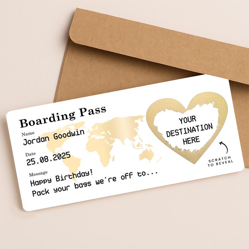 Personalised scratch reveal boarding pass gift card with brown kraft envelope. Features world map design, gold heart scratch-off revealing surprise travel destination, customised with name “Jordan Goodwin”, date “25.08.2025”, and birthday message “Happy Birthday! Pack your bags we’re off to…”. Perfect travel surprise or holiday gift voucher presentation.