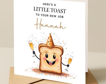 May include: A white card with a cartoon illustration of a slice of toast wearing a party hat and holding two glasses of champagne. The text on the card reads "Here's a little toast to your new job Hannah".