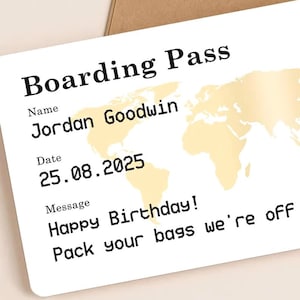 Unique travel surprise gift card designed as a boarding pass, complete with personalised details, world map print, gold scratch-off heart to reveal destination, and brown kraft envelope. Reads “Happy Birthday! Pack your bags we’re off to…”, making it a creative way to announce holidays, romantic getaways, or special travel gifts.