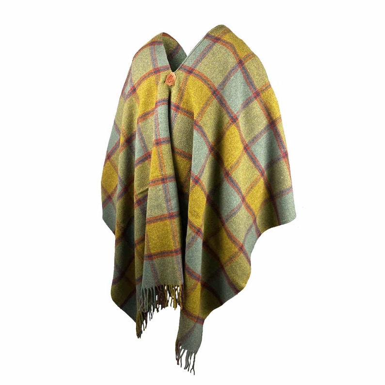 May include: A green, yellow, and red plaid poncho with a wooden button.