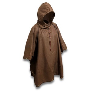 May include: A brown hooded poncho with a drawstring closure. The poncho has a long, flowing design and is made of a water-resistant material.