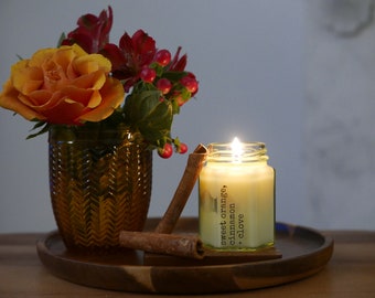Sweet orange, cinnamon + clove cosy essential oil candle. Vegan, sustainable gift, plastic-free packaging