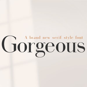 以下が含まれることがあります： 白い背景に黒い文字で「Gorgeous」という新しいセリフスタイルのフォント