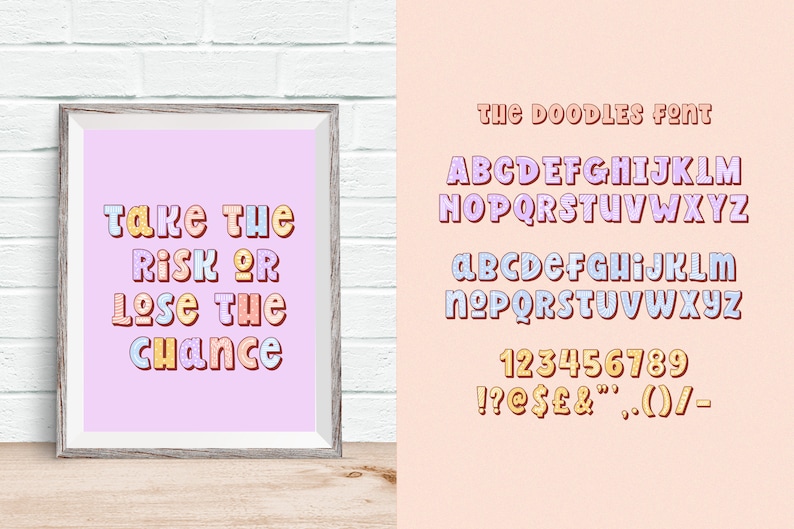 May include: A framed print with the text "Take the risk or lose the chance" in colourful bubble letters. Next to it, a font chart displays the alphabet, numbers, and symbols in the same style. The background is a light pink.