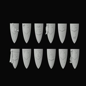 May include: Twelve grey, shield-shaped emblems, each with a stylized raven design. Various emblems include additional symbols like feathers, an eye, a crescent moon, and a hand. The shields are arranged against a black background.