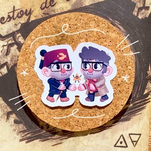 May include: Two cartoon characters, one wearing a red fez and the other wearing a brown coat and glasses, are shaking hands. A small cartoon triangle with an eye is between them. The characters are on a cork background.