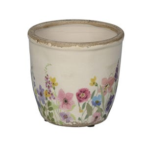 Könnte beinhalten: Cremefarbener Keramik-Blumentopf mit abgenutztem Rand. Der Topf ist mit einem farbenfrohen Blumendesign mit rosa, lila, gelben und blauen Blumen verziert. Geeignet für den Innen- und Außenbereich. Durchmesser ca. 15 cm.