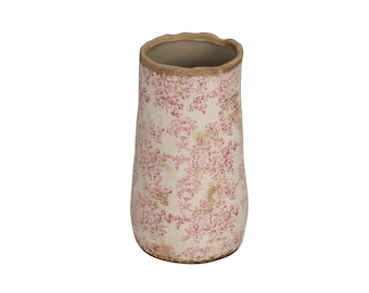 Può includere: Un vaso in ceramica bianca con un motivo floreale rosa. Il vaso ha un'apertura leggermente svasata e un fondo arrotondato.