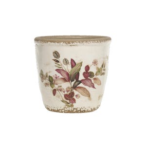 Könnte beinhalten: Ein weißer Keramiktopf mit einer abgenutzten Oberfläche und einem Blumendesign mit rosa und grünen Blumen.