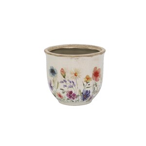 Könnte beinhalten: Ein cremefarbener Keramikübertopf mit rissiger Glasuroberfläche, verziert mit einem bunten Aquarell-Druck verschiedener Wildblumen in Blau, Rosa, Gelb und Violett auf der Außenseite sowie einem glatten, hellen Innenbereich.