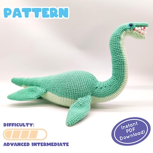 May include: A crochet pattern for a green and white crocheted sea monster. The pattern is labeled "PATTERN" and has a difficulty level of "ADVANCED INTERMEDIATE". The pattern is available as an instant PDF download.