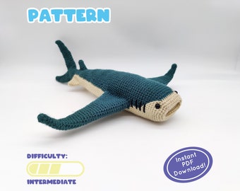 May include: Crochet pattern for a teal blue shark amigurumi toy. The pattern is labeled as intermediate difficulty and includes an instant PDF download.