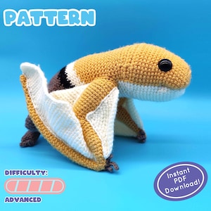 May include: Crochet pattern for a yellow and white amigurumi bat. The pattern is labelled "Advanced" and includes an "Instant PDF Download" button.