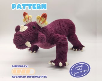 May include: Crochet pattern for a purple amigurumi rhinoceros with yellow and orange horns. The pattern is labeled as "advanced intermediate" in difficulty and is available for instant download as a PDF.