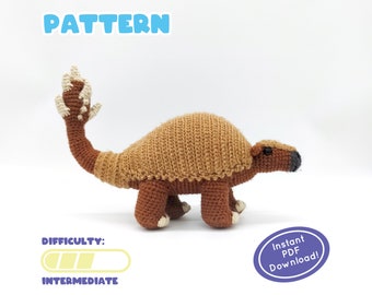 May include: Crochet pattern for a brown and tan amigurumi glyptodon, a prehistoric mammal. The pattern is labeled "Intermediate" in difficulty and includes an "Instant PDF Download" button.