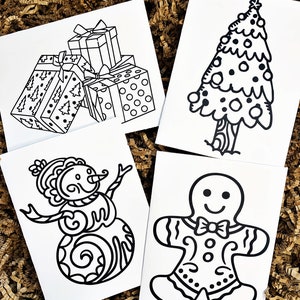 May include: Four black and white printable coloring cards featuring a Christmas tree, a snowman, a gingerbread man, and a stack of presents.