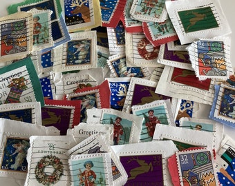 May include: A collection of vintage postage stamps with various designs, including animals, people, and holiday themes. The stamps are in different colors and sizes, and some have the words "Greetings" and "USA" printed on them.
