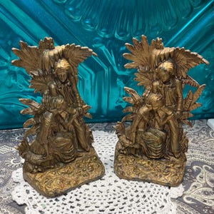 Antique heavy gilded cast iron bookends- Victorian couple - aged- little piece broken off
