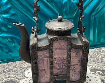 Vintage or antique ornate Chinese pewter tea pot with pictures behind glass- aged