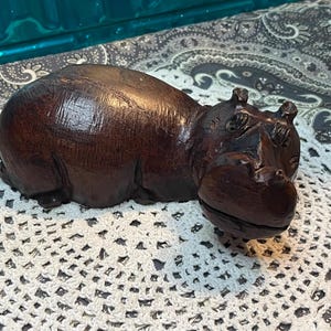 Vintage carved laying hippopotamus