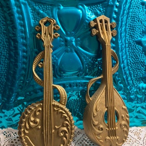 Vintage gold tone metal wall decor musical instruments set of 2
