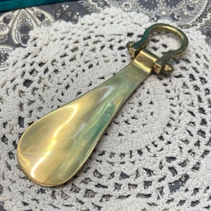 Vintage small sturdy brass shoe horn- aged