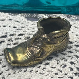 Vintage small brass shoe match holder- aged