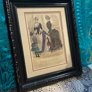 Antique framed matted fashion print  in vintage black wood - frame clearly showing it’s age