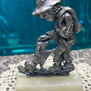 Vintage small pewter boy and dog statue on stone base