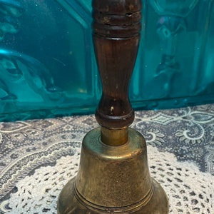 Vintage sturdy loud brass dinner bell -school bell with wood handle made in England- clearly showing its age
