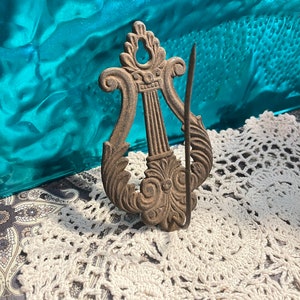 Vintage or antique Rusty rusted wall hanging metal receipt - order holder - aged