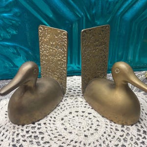 Vintage brass Duck bookends with unique ornate backplates - aged