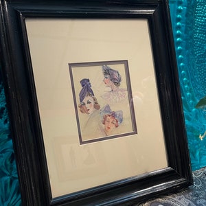 Vintage framed matted fashion print - ladies with hats - frame clearly showing it’s age