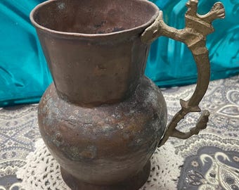 Antique or vintage primitive copper pitcher vase with bird brass handle -aged
